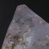 Pyrite flecks within Fluorite octohedron
